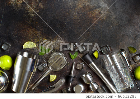 Bartender tools, ice, mint and lime for cocktail 66512285