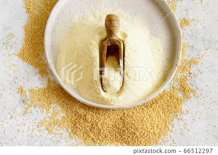 Plate of raw Amaranth flour with a scoop and Plate of raw Amaranth flour with a scoop and 66512297