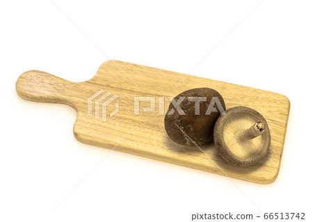 Thick raw shiitake mushrooms on a cut board Thick raw shiitake mushrooms on a cut board 66513742