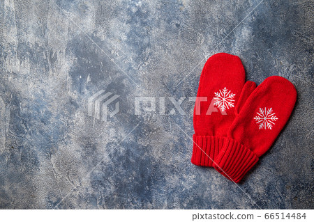 Christmas and New Year cozy holiday composition with scarf, woman hands in mittens, mugs with hot drink and marshmallow on the gray concrete background. Flat lay, top view. 66514484