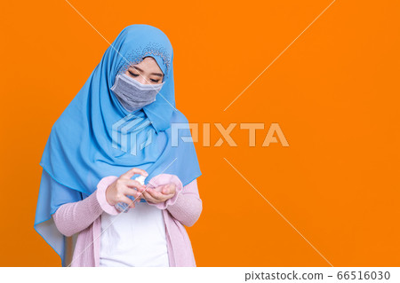 Muslim asian woman with traditional dress wearing 66516030