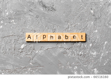 alphabet word written on wood block. alphabet text alphabet word written on wood block. alphabet text 66516160