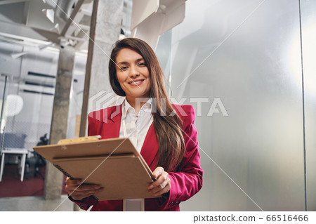 Tender longhaired girl waiting for her colleagues Tender longhaired girl waiting for her colleagues 66516466