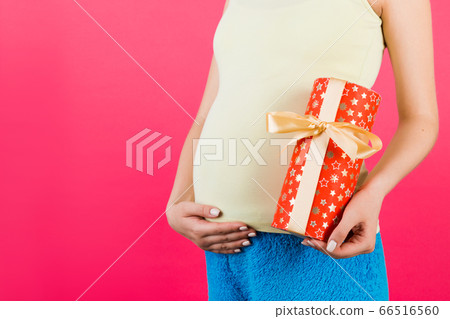 Cropped image of pregnant woman in white underwear 66516560