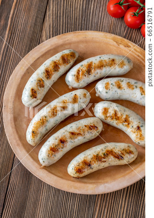 Grilled sausages on plate 66516791