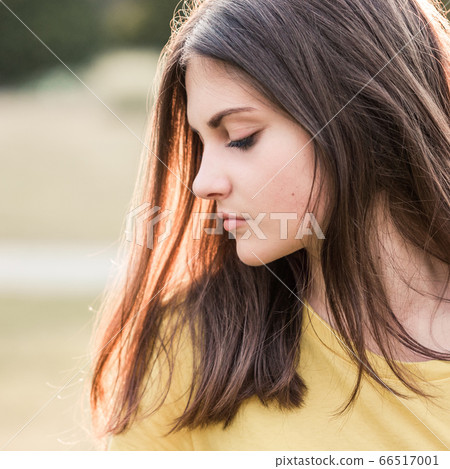 Portrait of a teenage girl with long hair 66517001