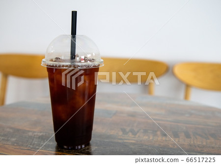 Cold Coffee with ice on the table in a cafe 66517225