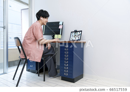 Image of a young male online meeting during telework Image of a young male online meeting during telework 66517559