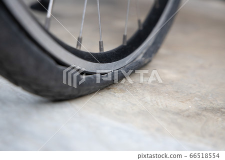 Flat Bicycle Tire on the Street 66518554
