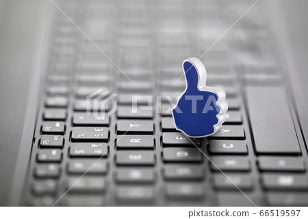 Thumb Up graphic illustration on laptop keyboard 66519597