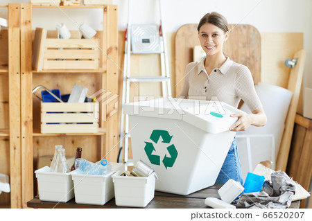 Woman with container for garbage Woman with container for garbage 66520207