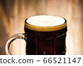 Close-up dark beer with foam in glass 66521147