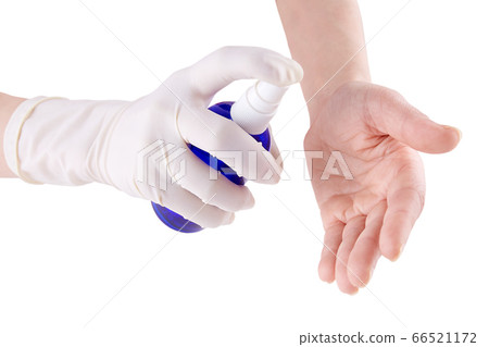Two hands and antiseptic spray isolated on white Two hands and antiseptic spray isolated on white 66521172