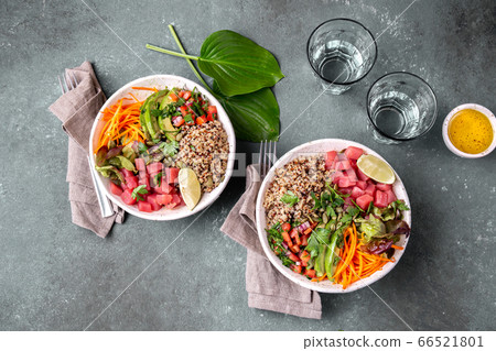 Tuna poke bowl with quinoa and vegetales. budda bowl. Quinua tuna salad on gray background Tuna poke bowl with quinoa and vegetales. budda bowl. Quinua tuna salad on gray background 66521801