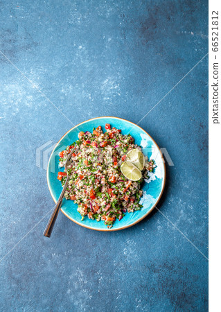 Traditional Lebanese salad tabouli tabule with quinoa, herbs, tomatoes, mint and lemon Traditional Lebanese salad tabouli tabule with quinoa, herbs, tomatoes, mint and lemon 66521812