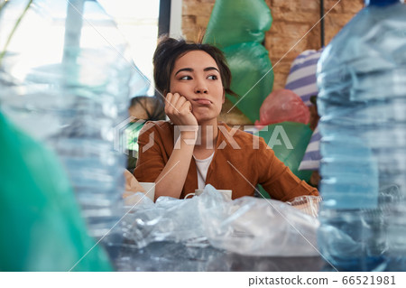 Untidy Asian female is in bad mood while looking on tons of garbage in her room 66521981