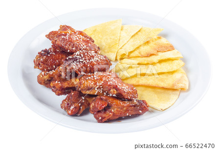 chicken wings in spicy sauce. popular pub dish. 66522470