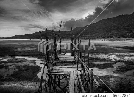 Wooden bridge with view of landscape and river, 66522855