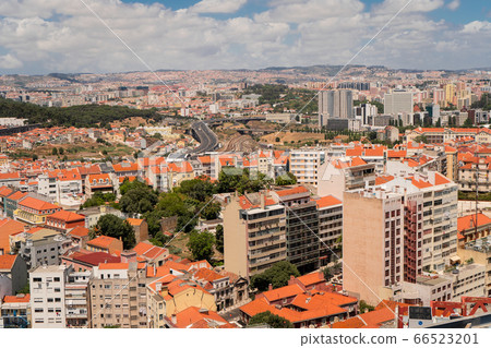 The capital of Portugal, Lisbon, top view of the orange roofs of houses, hotels, the sea coast 66523201