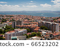 The capital of Portugal, Lisbon, top view of the orange roofs of houses, hotels, the sea coast 66523202