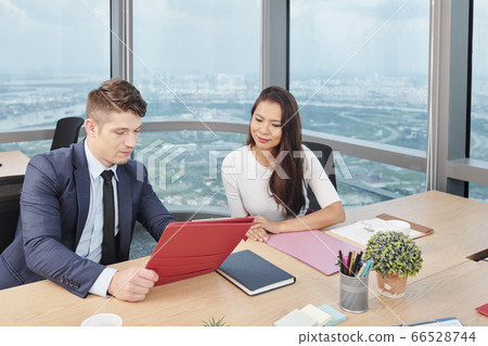 Entrepreneurs discussing document 66528744