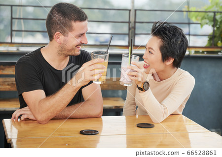 Friends drinking tasty cocktails 66528861