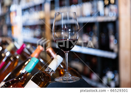 Red wine glass in wine shop Red wine glass in wine shop 66529301