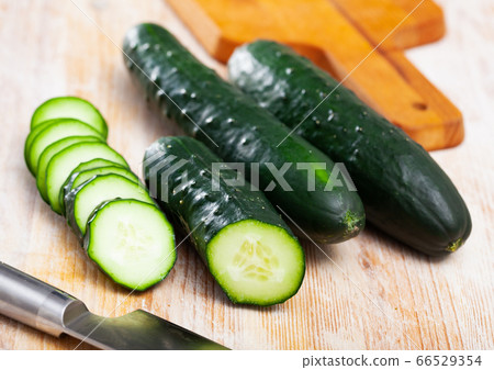 Fresh cucumbers with chopped slices Fresh cucumbers with chopped slices 66529354