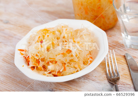 Homemade sauerkraut on white plate Homemade sauerkraut on white plate 66529396