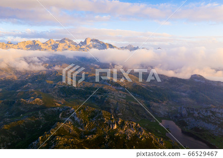 Mountain lake at sunset in Picos de Europa Natural Park. Spain Mountain lake at sunset in Picos de Europa Natural Park. Spain 66529467