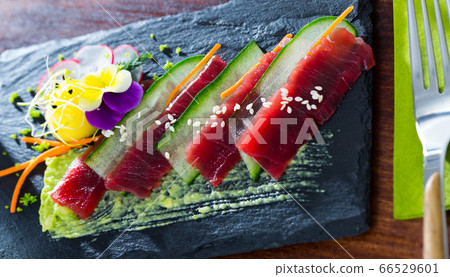 Tuna carpaccio with avocado sauce Tuna carpaccio with avocado sauce 66529601