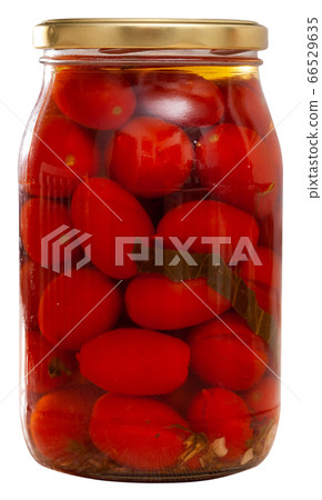 Glass jar of canned red tomatoes Glass jar of canned red tomatoes 66529635