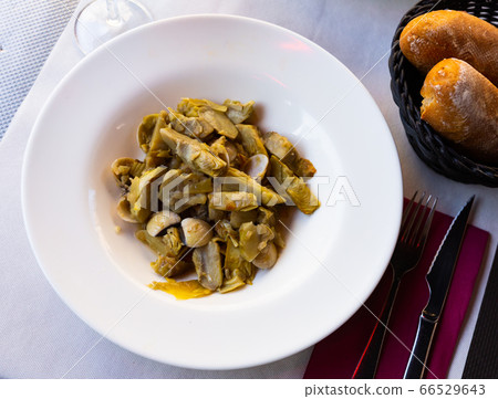Appetizing artichokes with sea shellfish Appetizing artichokes with sea shellfish 66529643