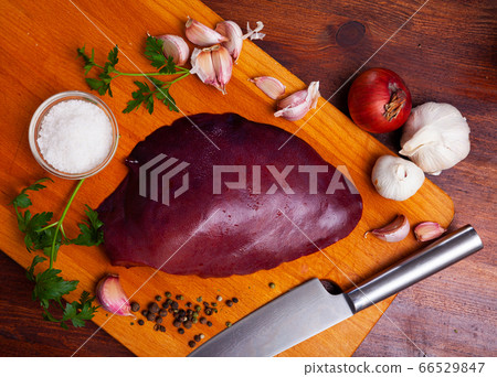 Cooking pork liver with parsley and garlic on the table Cooking pork liver with parsley and garlic on the table 66529847