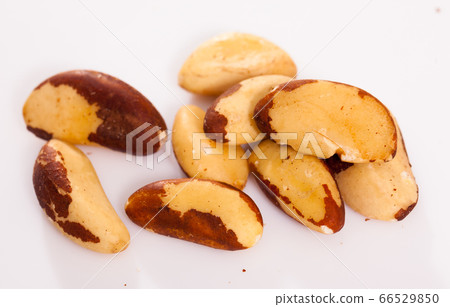 Brazilian nut scattered on white surface Brazilian nut scattered on white surface 66529850
