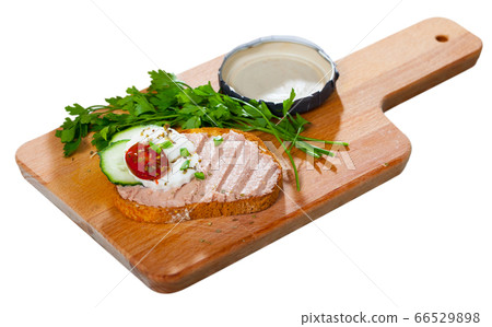 Pate on toasted bread with fresh cheese on wooden board Pate on toasted bread with fresh cheese on wooden board 66529898