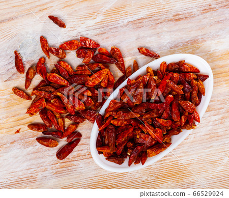 Dried cayenne peppers in bowl Dried cayenne peppers in bowl 66529924