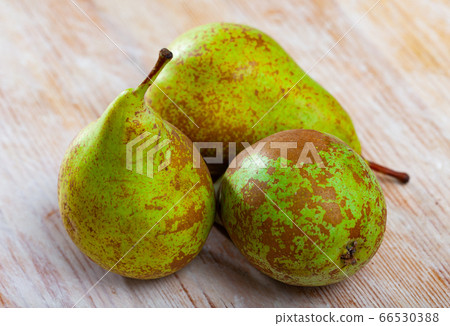 Fresh pears on wooden surface Fresh pears on wooden surface 66530388