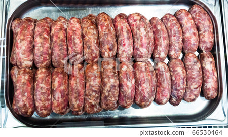 Raw frankfurters for frying on metal tray Raw frankfurters for frying on metal tray 66530464