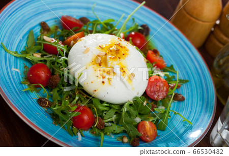 Burrata salad with arugula and tomatoes Burrata salad with arugula and tomatoes 66530482