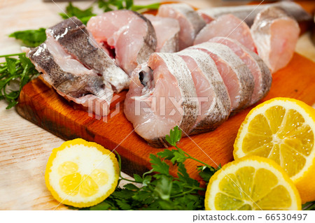 Raw haddock on wooden table 66530497