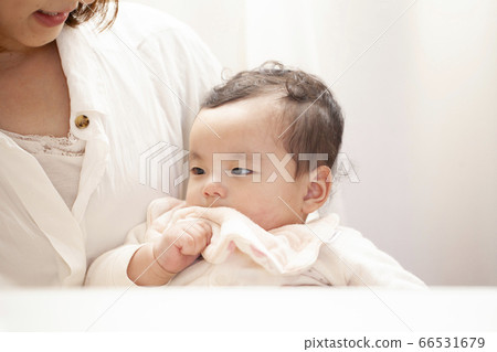 Baby eating baby food 66531679