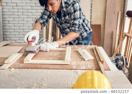 Carpenter Man is Working Timber Woodworking in Carpentry Workshops Carpenter Man is Working Timber Woodworking in Carpentry Workshops 66532257
