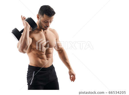 Shirtless bodybuilder holding dumbbell on shoulder. Shirtless bodybuilder holding dumbbell on shoulder. 66534205