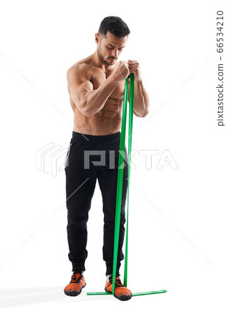 Bodybuilder training arms with resistance band. Bodybuilder training arms with resistance band. 66534210