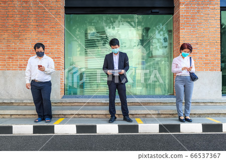 Asian people wearing mask and keep social Asian people wearing mask and keep social 66537367