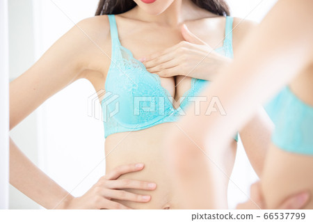 woman has breast augmentation woman has breast augmentation 66537799