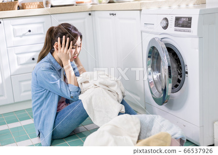woman wash clothes frustratedly 66537926