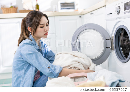 housewife wash clothes frustratedly 66537927