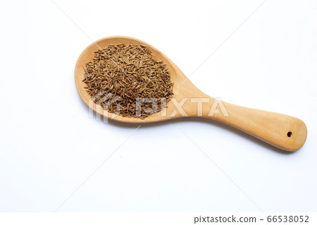 Cumin or caraway seeds on white background. Cumin or caraway seeds on white background. 66538052